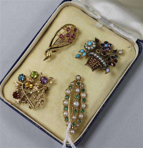 Three 9ct gold and gem set brooches and a yellow metal and gem set brooch, including two floral basket design, largest 37mm.